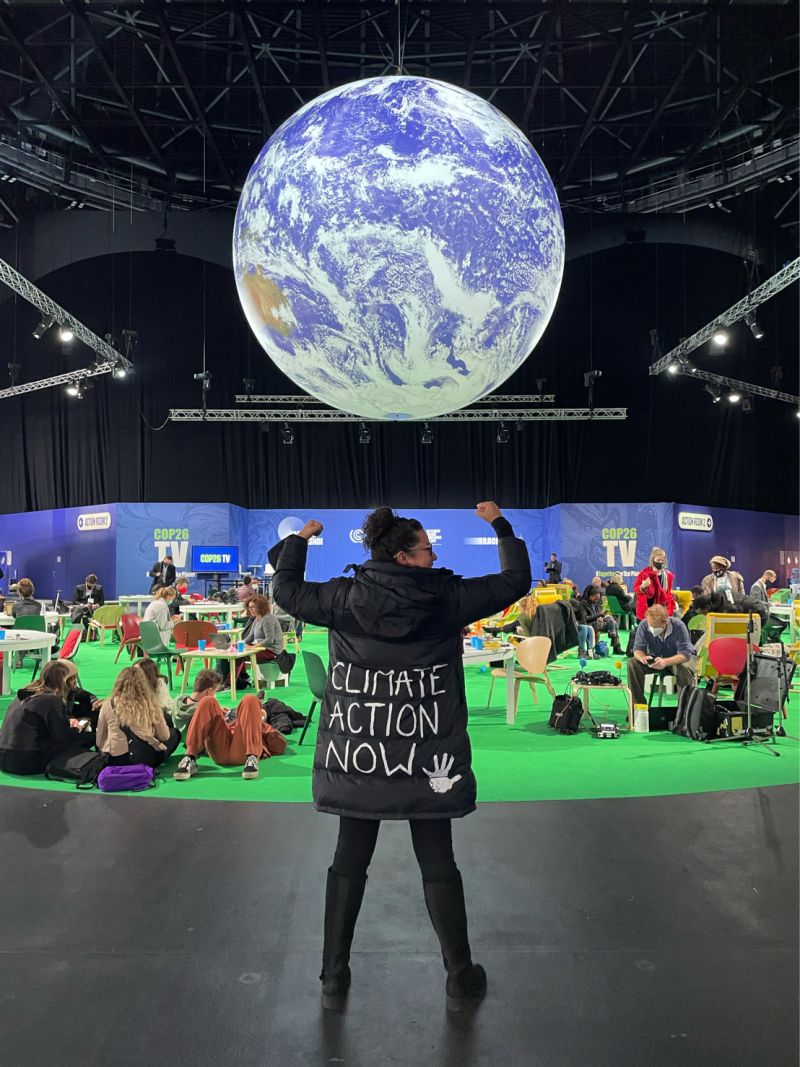 Sandra Guzmán Luna in black jacket with 'climate action now' written on the back.