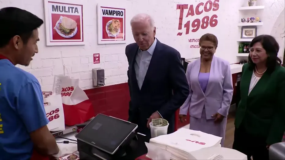 Joe Biden and Karen Bass, entering '1986 Tacos' taqueria in Los Angeles, showcasing a casual political visit to a popular eatery